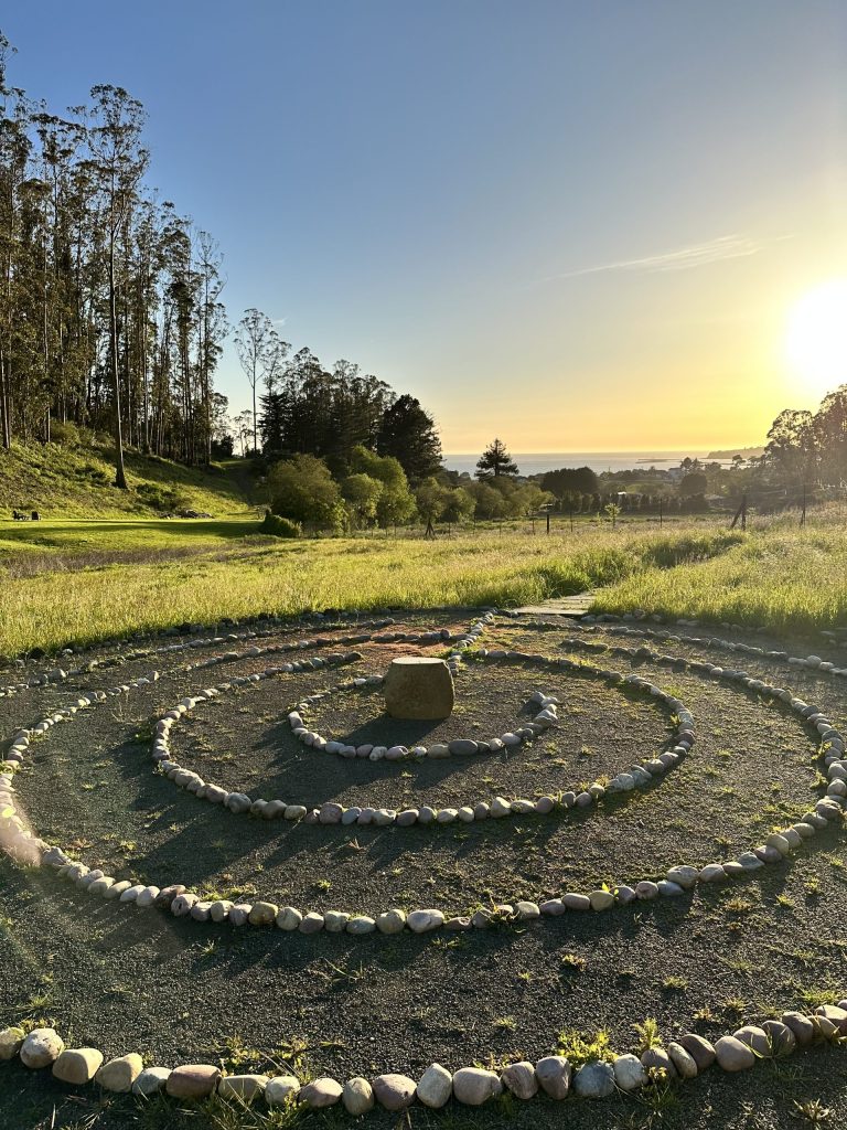 The Labyrinth with the sun setting over Pillar Point