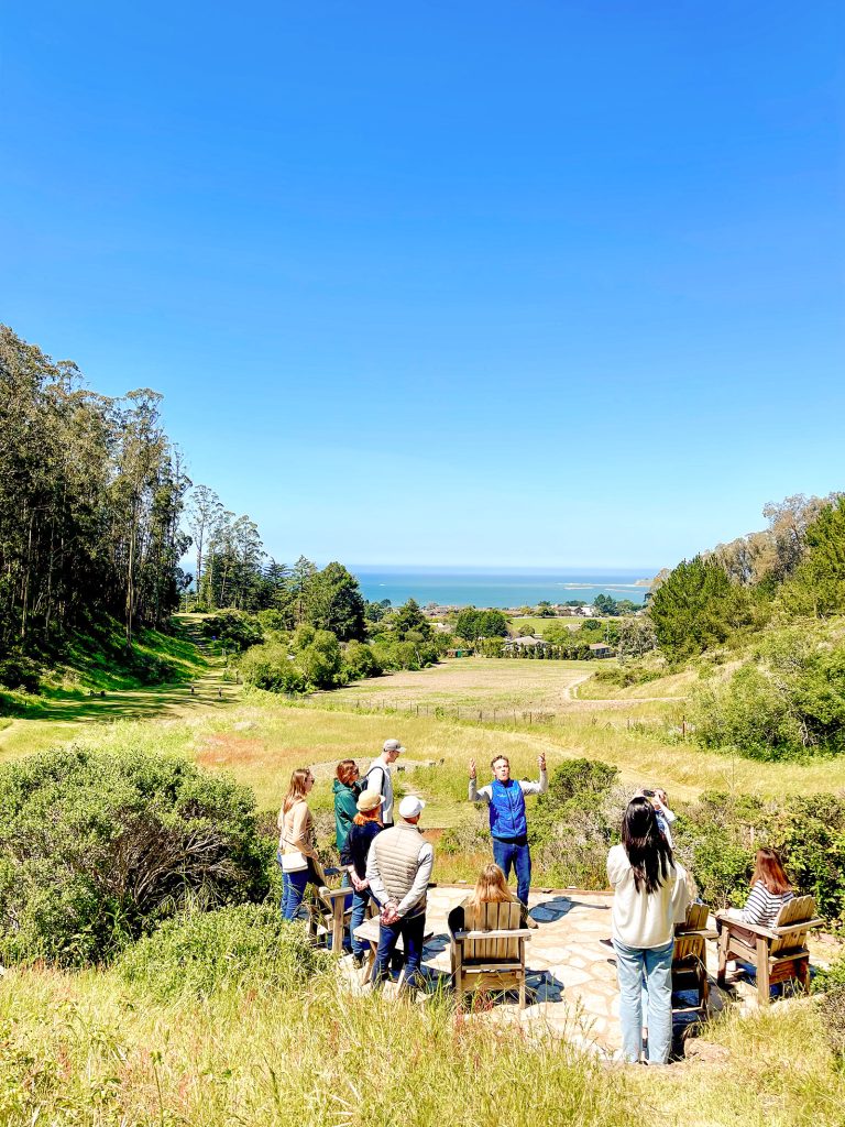Mark Battey speaks at a meeting of corporate leaders at the Miramar Farms labyrinth.